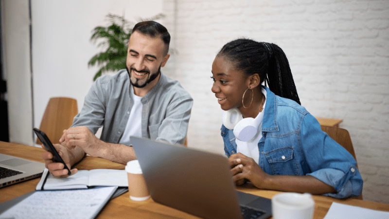 Discover The Top HOA Management Companies in Houston, TX: The Right Fit For Your Community 1 Image of two people talking about the top 5 HOA Management Companies in Houston, TX.