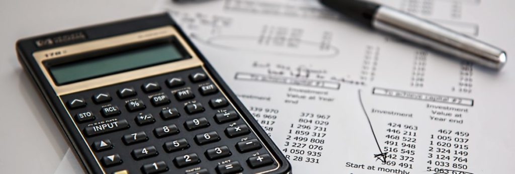 hoa budget best practices - Image of calculator with paper with figures on