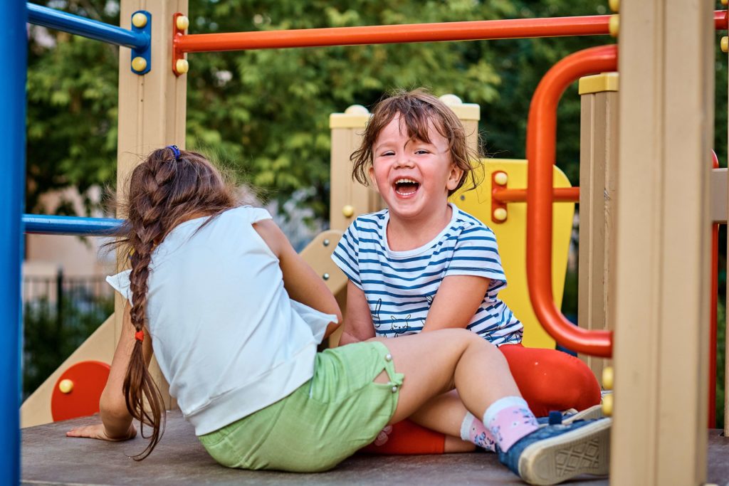 amenities playground - image of children laughing in playground