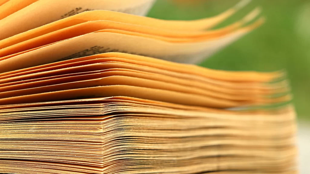 image of yellowing papers stacked up: hoa document storage