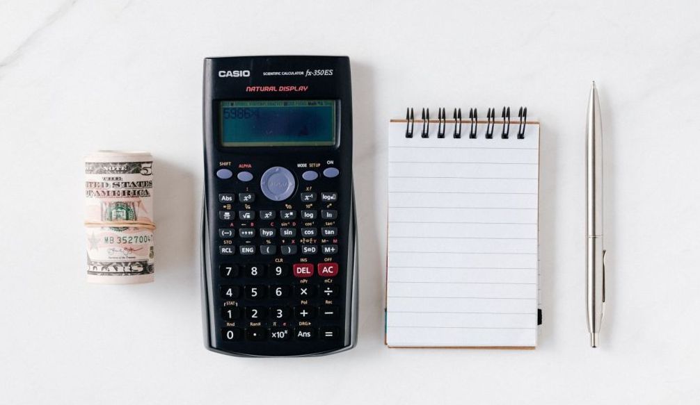 HOA Budget Meetings - Money, Calculator, Pen and Pad