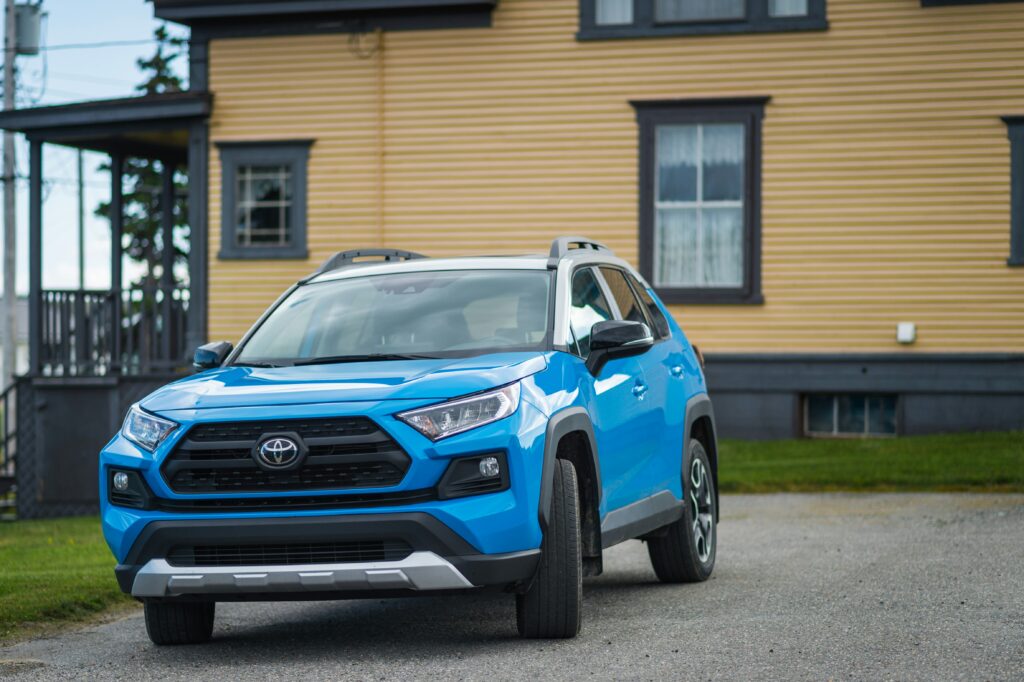 blue car in a hoa following parking rules