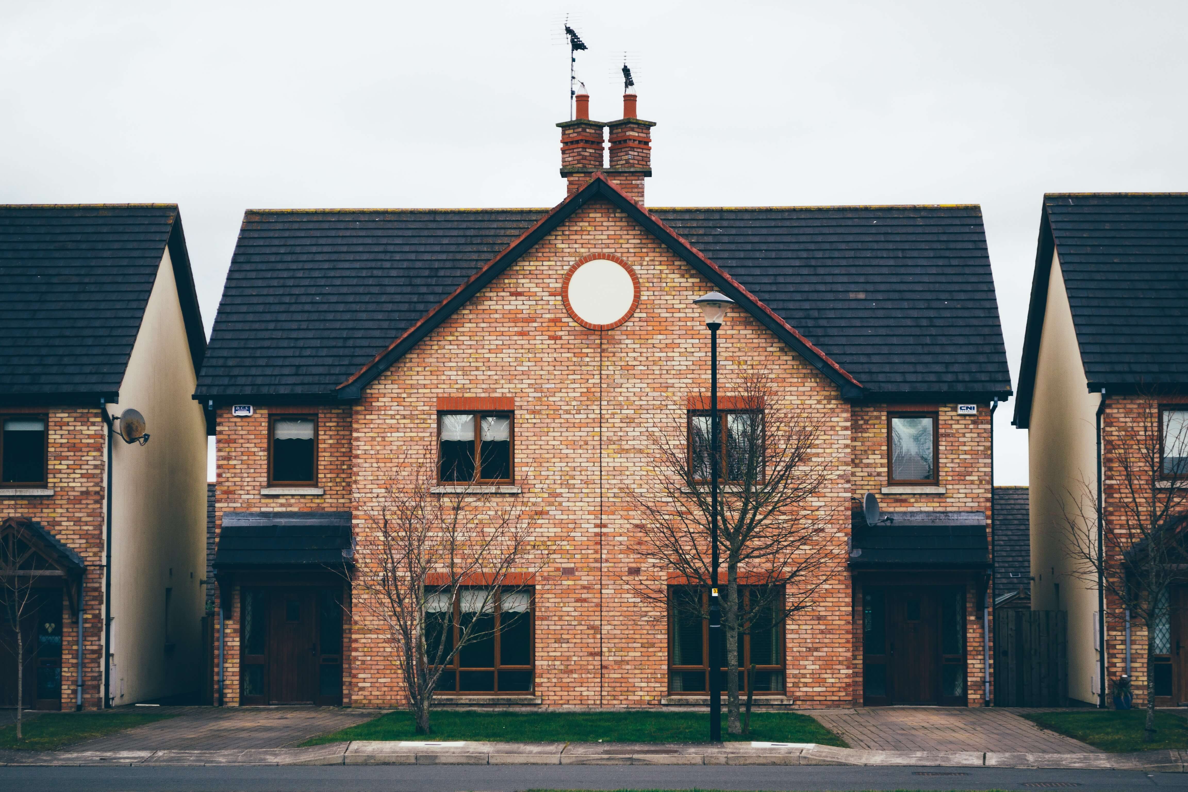 image of a brick house Purpose of an HOA - Image of a townhouse