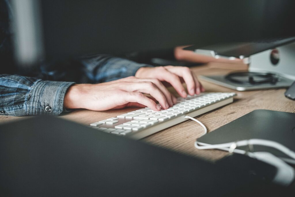 image of hands on a keyboard using community association software