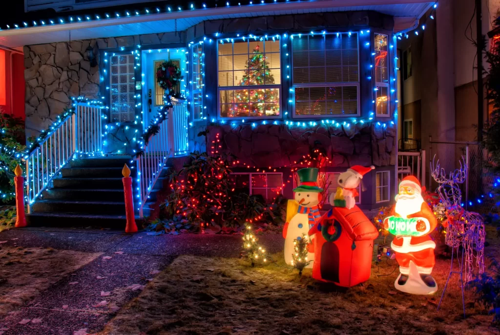Christmas lights illuminating a house during the festive season, representing HOA Christmas Decorations
