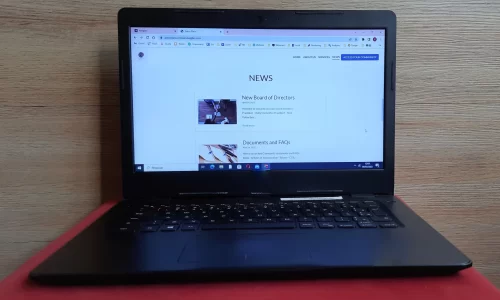 image of laptop with a HOA website open on news - it can be part of self-managed HOA software