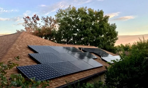 HOA solar panels on residential home, exemplifying sustainable energy solutions for homeowners' associations (HOAs)